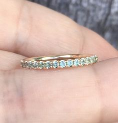 Full Eternity Band Ring with Natural Alexandrites. MaterialSolid Gold (14K/18K) or Platinum 950 FinishingHigh Polished/Shiny PlatingRhodium/Platinum Family (Only if white gold selected) FitComfort/Rounded Width1.8 mm Height1.8 mm SettingPave StoneNatural Alexandrites QualityAAA ColorColor Changing - Grey, Mint Green, Sage Green, Light Blue (see last 3 pictures for shades in different lightings) Shape & CutRound, Diamond Cut Stone Size1.5+ mm Click below to add laser engraving. https://www.et Round Cut Birthstone Eternity Band For Anniversary, Birthstone Eternity Band For Anniversary, Eternity Band With Birthstone For Anniversary, Adjustable Stackable Rings For Wedding, May Birthstone, Wedding Gemstone Eternity Band, Wedding Eternity Band With Gemstone, Sage Green Light, Ruby Eternity Band, Blue Sapphire Wedding Band