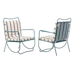 two chairs sitting next to each other on a white background