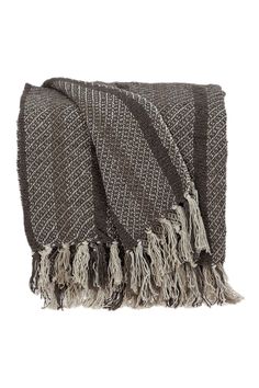 a brown and white blanket with fringes on it