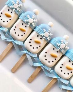 there are four pops with snowmen on them