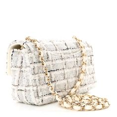 This is an authentic CHANEL Tweed Quilted Mini Rectangular Flap in White and Grey. This stunning small crossbody shoulder bag is crafted of white and grey tweed.  The bag features a light gold chain link shoulder strap threaded with white leather and a frontal flap with a light gold Chanel CC turn lock. This opens to a compact white leather interior with zipper and patch pockets. Chanel Mini Rectangular, Chanel Crossbody, Chanel Tweed, Chanel Flap Bag, Chanel Mini, Gold Chanel, Chanel Shoulder Bag, Grey Tweed, Sequin Mini