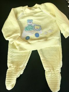 Soft and cuddly quilted style babies play suit by LOVESPUN . Hundred percent polyester washable in cheerful yellow . Top has white braiding on shoulders and Tufted center appliqué with fuzzy circus animals. Bottoms have elastic waist and footies . Outfit in good vintage condition , small amount of pilling , but still wearable and comfortable. Tag 3 to 6 months, top measures shoulder to hem 9 inches , Chest 9 inches . Pant waist to footie 13 inches . Playful Yellow Onesie For Loungewear, Cute Yellow Onesie For Loungewear, Play Suit, Circus Animals, Vintage Barbie Dolls, Yellow Top, Blue Dot, Baby Play, Vintage Fabrics