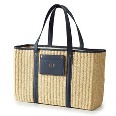 A dreamy tote perfect for picnics in the park, farmer’s market strolls and weekend trips to the beach – or your backyard! This spring-ready tote is woven from soft natural straw with faux leather trims and a handy detachable case for easy access to all your essential cards. Add a classic foil monogram to the removable card case for a personal touch. • 17.5”w x 6”d x 11”h• Woven from paper straw with a soft linen lining and polyurethane trim.• Detachable card case with magnetic snaps.• Could be M Personalized Beach Bags, Tennis Tote, Straw Beach Tote, Waterproof Beach Bag, Straw Beach Bag, Mark And Graham, Straw Bags, Straw Tote, Farmer's Market