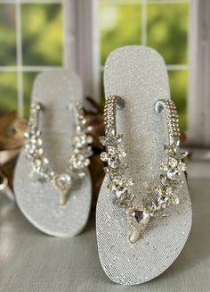 Elevate your gifting game with our eye-catching crystal sandal, the perfect choice for bridesmaid gifts or bridal shower presents. Trendy, fashionable, and sparkling, it's an ideal way to show your appreciation for those special occasions. Say goodbye to ordinary gifts and hello to extraordinary moments with these special finds for your loved ones. *For more gift options take a look at our best seller flip flops https://designbydesirenyc.etsy.com/listing/1304420049 PRODUCT DETAILS  - Rubber flip Gold Sparkling Sandals For Wedding, Sparkling Gold Sandals For Wedding, Silver Crystal Sandals For Party, Glamorous Wedding Sandals With Adjustable Fit, Glamorous Adjustable Wedding Sandals, Crystal Open Toe Sandals For Wedding, Glamorous Clear Sandals For Wedding, Elegant Clear Sandals For Wedding, Silver Bling Wedding Sandals