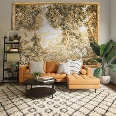 a living room with a large tapestry on the wall