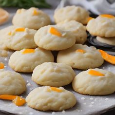 some cookies are sitting on a plate with orange peels