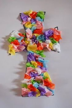 a cross made out of colored tissue paper