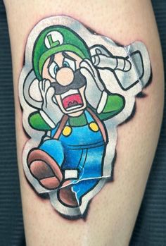 an image of a cartoon character tattoo on the leg, with a green hat and mustache