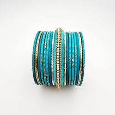 Beautifully designed bangles for any occasion. South asian bracelets come in a variety of styles, colors, and finishes. We at Banglez take creating the perfect bangle set for you to another level! You could say helping you find your favorite stack of bangles as one of our greatest missions. This bangle set was curated in house by one of our talented team members. We hope you love them as much as we do! Stackable Turquoise Jewelry For Festivals, Blue Bangle As A Festival Gift, Turquoise Stackable Bracelets For Festivals, Blue Festive Bracelets For Festivals, Blue Bangle Jewelry For Festivals, Blue Bangle For Festivals, Traditional Adjustable Blue Bangle, Blue Bracelets For Festivals, Blue Bangle Bracelet For Festivals