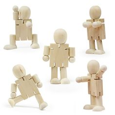 several wooden figures are arranged in the shape of people