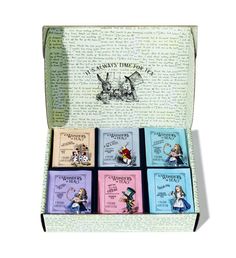 a box with six books in it on top of a white surface and an image of alice