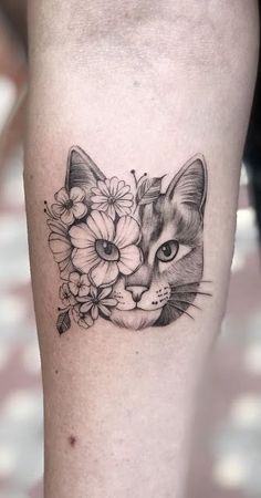 a cat with flowers on it's leg