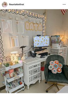 a desk with two chairs and a computer on top of it in front of a wall