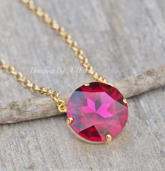 "A gorgeous new necklace made using a large round crystal. The crystal is round, brilliant cut and 27mm in size (over 1\"). It is fuchsia in color. Crystal is set into a premium prong setting that is heavy gold plated. it connects to rolo style chain. Please choose desired necklace length at checkout. Necklace features a lobster clasp. * Nickel and lead free" Large Crystal, Color Fuchsia, Rose Gift, Gold Necklace Layered, Fuchsia Color, Layering Necklace, Large Crystals, Vintage Crystal, Necklace Length