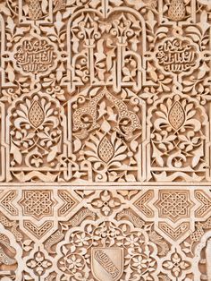 an intricate carving on the side of a building in marraket, morocco photo