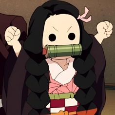 an animated image of a woman with long black hair holding a green object in her mouth