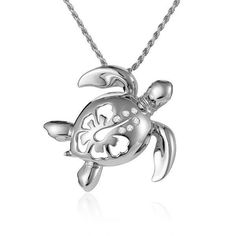 This 14K solid white gold sea turtle pendant features our original Honu motif paired with a hibiscus cut-out design and diamonds. Hawaii’s Honu, or sea turtles, are one of the Aumakua, or deified ancestors, known to unite heaven and earth while they symbolize endurance and wisdom. Wear our Paradise Honu pendant for good fortune and life longevity. In Hawaiian culture, flowers symbolize all that is positive. The yellow hibiscus is Hawaii’s official state flower representing delicate beauty, unity Elegant Silver Turtle Jewelry, Elegant Sterling Silver Turtle Jewelry, Yellow Hibiscus, Sea Turtle Necklace, Hawaiian Culture, Turtle Necklace, Turtle Pendant, Sea Turtles, Cut Out Design