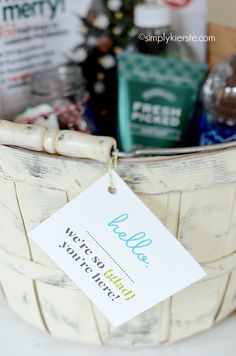 a basket filled with lots of different types of things to put on the basket for someone's christmas gift