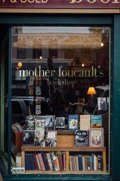 there is a book shop with many books in the window