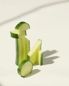 cucumber slices cut into small pieces on a white surface