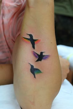 three hummingbirds tattoo on the left ankle