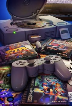 several video game controllers and games on a table