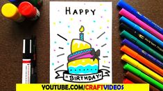 a birthday card with markers and crayons on the table next to it is an image of a cake