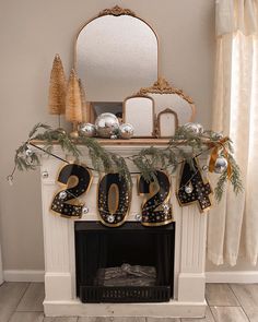 a decorated mantle in the corner of a room with a mirror and decorations on it