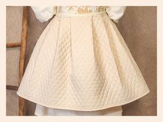 This 20" muslin quilted petticoat creates a lovely, round shape to provide support for the feminine silhouette across several historical time periods.  Fabric is pleated onto a waistband that ties in the historical manner; the back of the skirt sits against the small of the back and ties in center front, and the front of the skirt sits against the stomach and ties at center back. Features the standard opening at the side seam. Quilted Petticoat, Time Periods, Feminine Silhouette, Women's Costumes, Petticoat, Round Shape, Favorite Outfit, Art Collection, Bathing Beauties