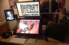 a computer monitor sitting on top of a wooden desk next to a keyboard and mouse