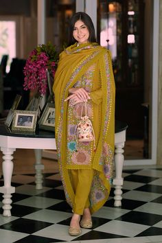 This Suit is a suitable amalgamation of style and grace that is required from ethnic wear. The dress is ideal for any formal or informal gathering. Crafted with the utmost care, our plazzo suits are made from high-quality fabrics that offer comfort and breathability, allowing you to move effortlessly. The highlight of our salwar suit, is meticulously designed to enhance your beauty. It comes in a range of stunning styles, catering to diverse occasions and preferences. Chest Size: Medium: 38 Inches Large: 40 Inches X-Large: 42 Inches XX-Large: 44 Inches XXX-Large: 46 Inches FABRIC : Top: Organza With Fancy Embroidery Work With Khatali Work Bottom – Heavy silk Duppta – Organza With Embroidery Work Gpo Lac NOTE: COLOR MAY SLIGHTLY VARY FROM THE PICTURE NOTE: This Suit is stitched in size 38, Unstitched Bollywood Suits With Dupatta, Traditional Semi-stitched Suit With Dupatta, Festive Georgette Suit With Dupatta, Bollywood Style Suits With Resham Embroidery For Eid, Traditional Festive Georgette Suits, Festive Suits With Dupatta For Eid, Festive Bollywood Suit With Dupatta, Bollywood Style Suit With Dabka Work For Eid, Unstitched Chikankari Embroidery Suit For Festive Occasions