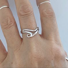 Sterling Silver Swirly Wave Ring, Surf Ring, Boho Ring, Silver Ring, Ocean Ring, Beach Ring, 925 Stamped Face Height: 9 Mm Finish: Rhodium Plated Material: 925 Sterling Silver Modern Twist Swirl Ring For Gifts, Modern Twist Swirl Ring As Gift, Modern Twist Swirl Ring For Gift, Sterling Silver Spiral Stackable Rings As A Gift, Adjustable Sterling Silver Wavy Rings, Adjustable Silver Wavy Rings, Adjustable Wavy Sterling Silver Jewelry, Spiral Stackable Sterling Silver Rings For Gift, Spiral Stackable Sterling Silver Rings As Gift