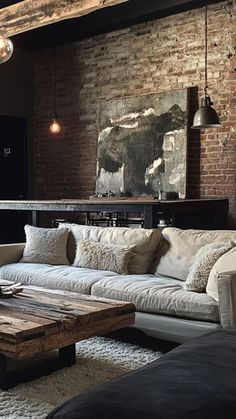 a living room filled with furniture and a brick wall