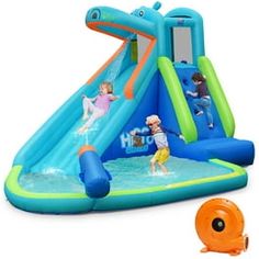 an inflatable water slide with two children playing on it