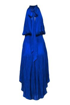 Be the belle of the ball in this Ramy Brook dress! The sleek royal blue satin hugs your silhouette, while the tie back keyhole adds an unexpected, yet sophisticated detail. Let your natural beauty shine - you don't need to over-accessorize, just throw on those heels and some silver jewelry and you'll be rsvp-ready! Size M 100% Polyester Unlined Pullover Neck tie closure Keyhole back Smocked waist Sleeveless Bust 36" Waist 25" Shoulder to hem 52" Blue Satin Halter Dress For Spring, Royal Blue Sleeveless Satin Dress, Blue Satin Halter Evening Dress, Blue Satin Halter Dress For Summer, Blue Satin Halter Dress For Night Out, Blue Silk Dress With Tie Back, Chic Blue Satin Halter Dress, Blue Satin Halter Dress For Parties, Blue Tie Back Dress For Gala