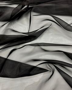 Black Crystal Organza Fabric 60" Wide by the Yard for Fashion, Crafts, Decoration. This sheer and soft organza fabric is a versatile choice for numerous creative projects from elegant garments to festive decorations. This  black sheer Organza is ideal for creating everything from  wedding gowns, evening dresses, costumes, prom attire and bridal sets  to event backdrops. Infused with glitter, this fabric is perfect for event decor. Its sheer elegance brings a special charm to settings like baby s Prom Attire, Event Backdrops, Fashion Crafts, Event Backdrop, Organza Fabric, Fabric Black, Black Crystals, Bridal Sets, Festival Decorations