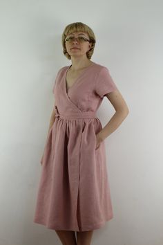 "Spring dress, Write the selected color in the message Handmade rose wrap dress with short sleeves, 2 pockets and belt , perfect for casual wear and suitable for any occasion in any season Details: - 100% natural linen produced in Europe ; - medium weight (180 gram per square meter); - color: rose, could be any from our colors catalog (color samples at the photo); Made to order, approximately a few days, If you have any questions please message me and I will be glad to answer. Size guide : Size Summer Linen Midi Dress With Surplice Neckline, Linen Dress With Tie Waist And Surplice Neckline, Pink Short-sleeved Linen Dress, Pink Wrap Dress For Summer, Summer Pink Wrap Dress, Summer Belted A-line Wrap Dress, Pink Linen Dress With Short Sleeves, Pink Short Sleeve Linen Dress, Pink Wrap Dress For Beach