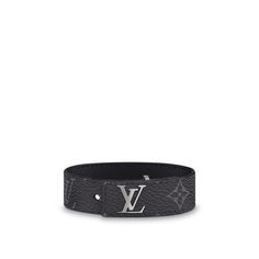 Slim and sleek, with an inlaid lv clasp that lies flush to the strap, this new masculine bracelet is offered in black calfskin, monogram or monogram eclipse coated canvas. All are calf-leather lined. Easy to wear, this signature piece makes a handsome little gift. Luxury Engraved Leather Bracelet, Elegant Engraved Leather Bracelet For Formal Occasions, Luxury Black Leather Engraved Bracelet, Luxury Black Engraved Leather Bracelet, Luxury Adjustable Engraved Cuff Bracelet, Luxury Engraved Black Leather Bracelet, Luxury Engraved Adjustable Cuff Bracelet, Luxury Black Cuff Bracelet, Luxury Adjustable Leather Bracelet