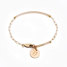 "Our link chain bar bracelet features it all: A front and back bar for personalization, and a small disc pendant at the back which can also be personalized. We can hand stamp your name, date of birth, wedding date etc. This slender piece evokes effortless cool, and is available in 14k gold filled or sterling silver. (All designs copyright Luca Jewelry LLC.). | WHAT WE CAN STAMP | *The main nameplate can be personalized with up to '14' characters. *The back 'smaller nameplate', can be personalize Bracelet With Pendant, Personalized Silver Bracelets, Silver Bar Bracelet, Nameplate Bracelet, Gold Bar Bracelet, Back Bar, Bar Bracelet, Id Bracelets, Engraved Bracelet