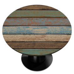 a round wooden table top with multicolored wood planks and black metal base