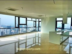 an empty room with large windows and floor to ceiling windows overlooking the cityscape