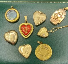 "A collection of beautiful antique and vintage lockets in solid yellow gold - ready for you to add your own photos and memories! Sold individually. 1. 14k bell-shaped locket, with ruby. Opens from the bottom. Engine-turned interior, florentine details on exterior. 6.78g, 1\"X 1\". 2. 14k heart locket, with etched decoration and star-set diamond. Matte finish. 3.95g, 1\" x 0.75\". 3. 18k heart locket, with red enamel and a gold overlay in a foliate design. Vintage french manufacture. 5.05g, 1.4\" Heirloom Yellow Gold Locket Necklace With Charms, Antique Yellow Gold Locket Necklace With Charms, Antique Yellow Gold Locket Necklace For Valentine's Day, Antique Locket Necklace With Charms For Anniversary, Vintage Lockets, Gold Overlay, Victorian Women, Diamond Star, Jewel Box