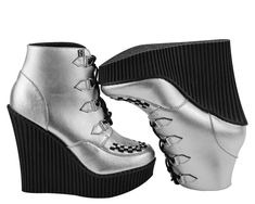 With these shiny silver T.U.K. Creeper Wedge Booties on your feet you'll be everyone's fun ADD distraction. The silver metallic leather upper features petite d-ring tabs and silver metal d-rings with black laces for tying up. The black interlace on the front give these wedges the classic creeper look. The bootie upper is about 4 ½ inches high, finishing right above the ankle. The ridged PU sole is lightweight and the height ranges from about 5 1/4 inches in the back to 1 1/4 inches in the front. Creepers Shoes, D Rings, Lace Up Heels, Shiny Silver, Creepers, Black Laces, D Ring, Metallic Leather, Wedge Heels