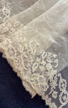 an image of white lace on the fabric that has been made to look like something out of