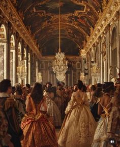 a group of people dressed in fancy clothing standing inside of a building with chandeliers hanging from the ceiling