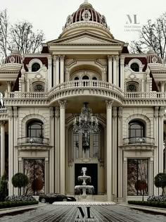 a large building with a fountain in front of it