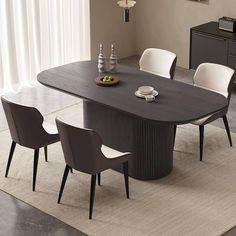 a dining room table with chairs around it