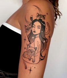 a woman with a cat and moon tattoo on her arm, holding a teddy bear