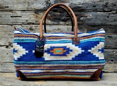 Handcrafted, Functional and stunning . 100% Leather handles + protective corners and Handwoven Wool. This eye catching weekender is meant for getaways. The southwestern boho design and our top grain leather stands out in a crowd and is sure to be show stopper. Perfect carry on or weekend get away bag. Dimensions: 21" x 11" x 11" (carry-on friendly) Exterior- Handles Made From 100% Top Grain Leather Body Is 100% Handwoven Wool Built Tough With Top Carry Handles 4 Feet To Keep Bottom Clean Our Bag Southwestern Boho, Leather Stand, Boho Design, Boho Designs, Leather Handles, Top Grain Leather, Duffel Bag, Leather Handle, Straw Bag