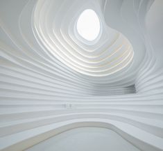 the interior of a white building with circular windows